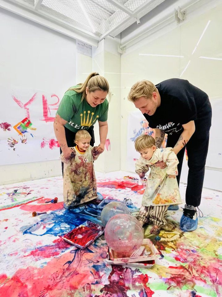 A child exploring colour and materials